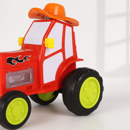 Детская игрушка-трактор с трюками и световыми эффектами
